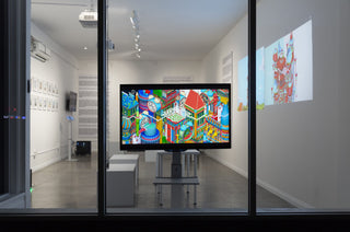 An image of an art gallery at night in front of the window