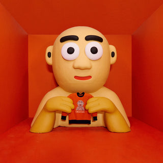 A stylized bald person holding a red sweater in a red room